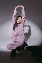 A Woman Stretching Her Arms Up