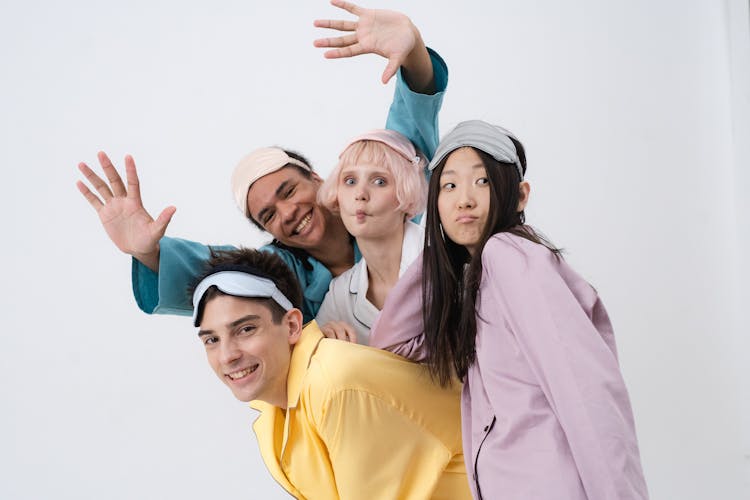 Smiling Men And Women In Colorful Clothes