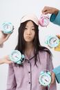 Girl in Pink and White Hello Kitty Button Up Shirt Holding White and Pink Round Analog
