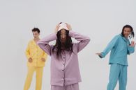 Man in Pink Hoodie Standing Beside Woman in Yellow Hoodie