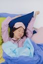Girl in Blue Hoodie Lying on Bed