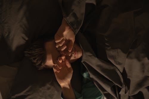 Free Man Covered in a Brown Blanket Sleeping Stock Photo