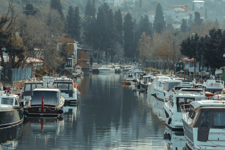 Ultimate Mega Star Yacht Tour with Lunch, Foam Party & Transfer From Belek Review: A Full Day on Turkey's Turquoise Coast Review 2026 - Picturesque canal in İstanbul featuring moored motorboats and lush surroundings.