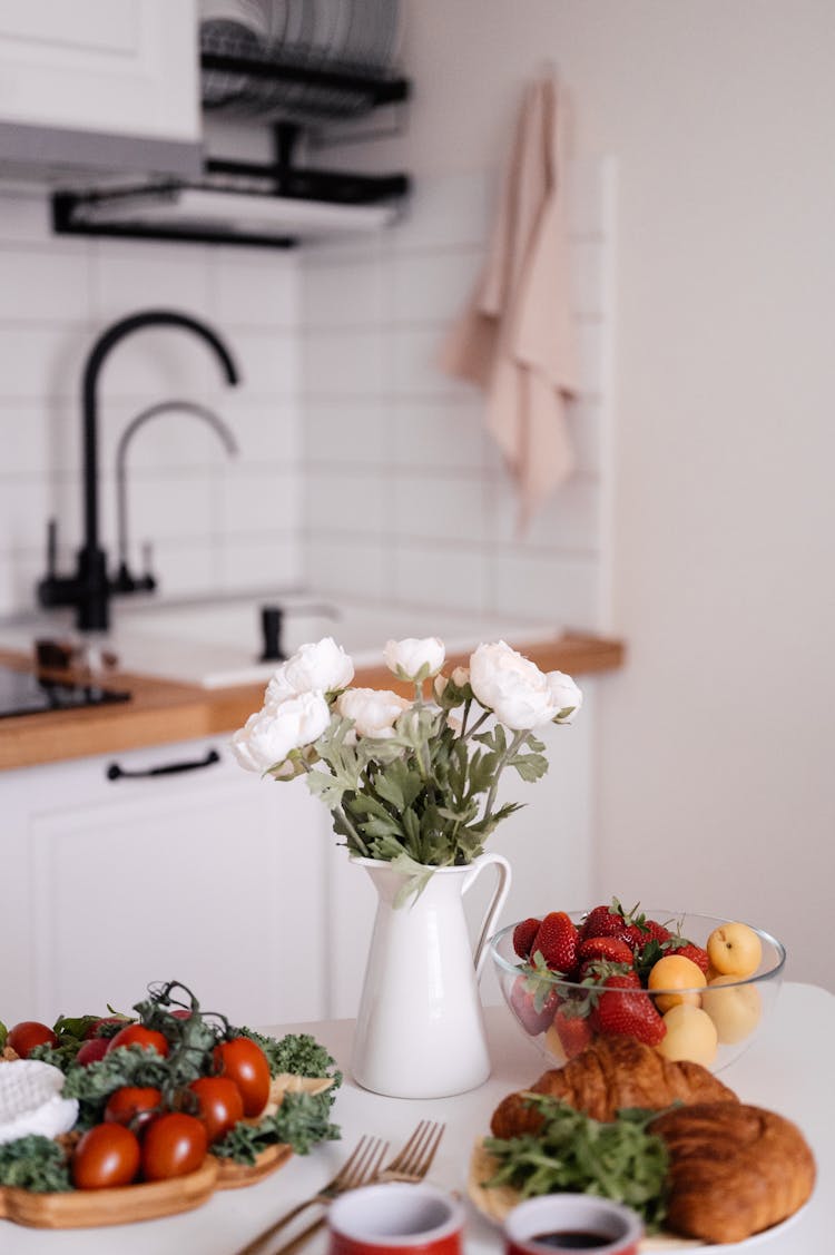 A Table With Fruits, Vegetables And Bread