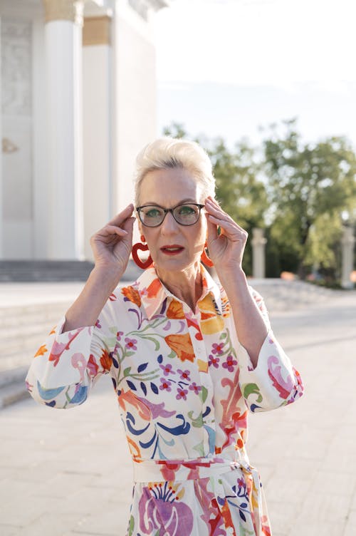 woman confidently wearing a colorful dress in an office