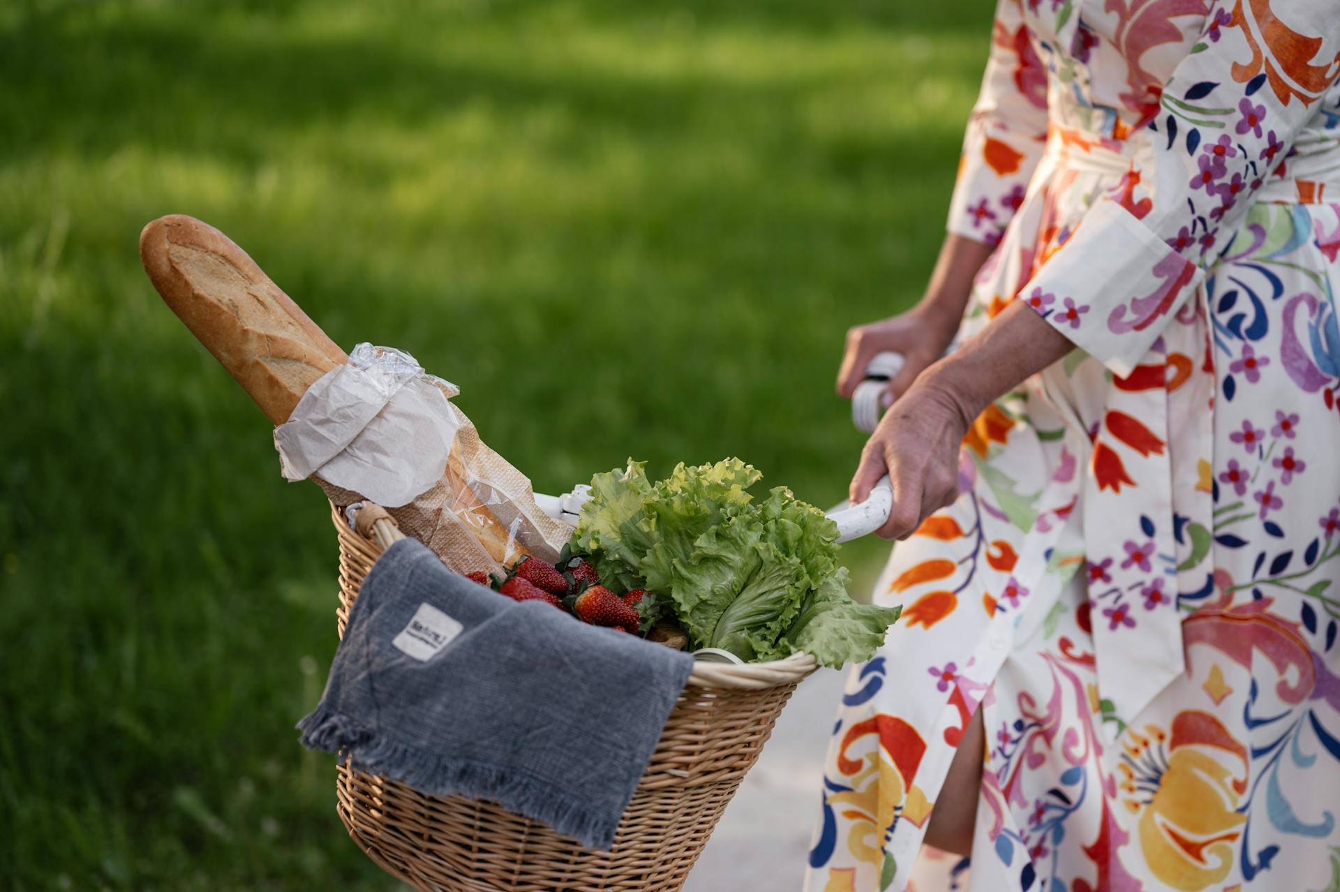 A Person with a Bicycle Basket with Food