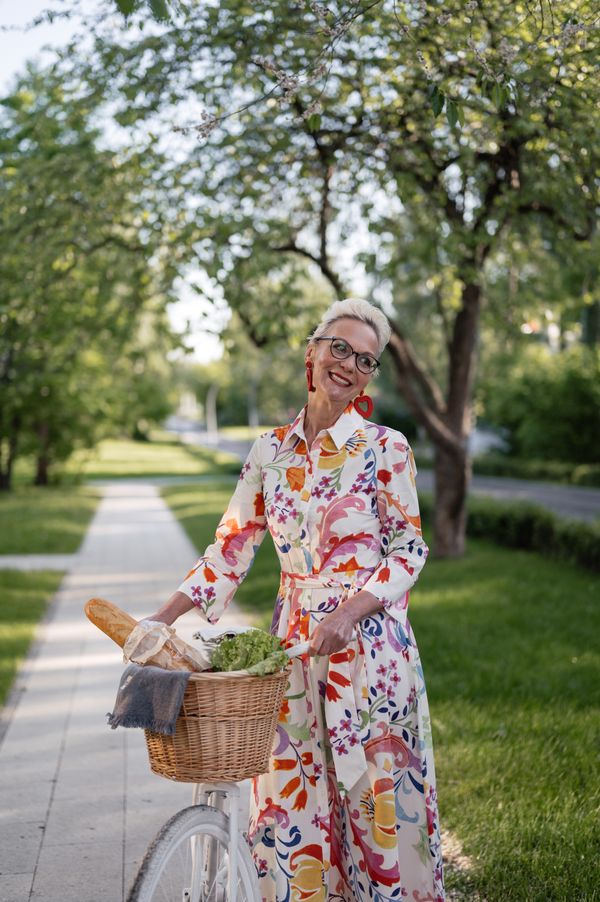 Woman in a knee-length floral wrap dress