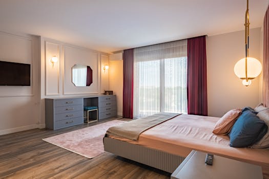 A modern bedroom featuring elegant decor and a chic color palette.