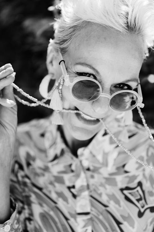 Black and White Photo of a Woman Wearing Sunglasses