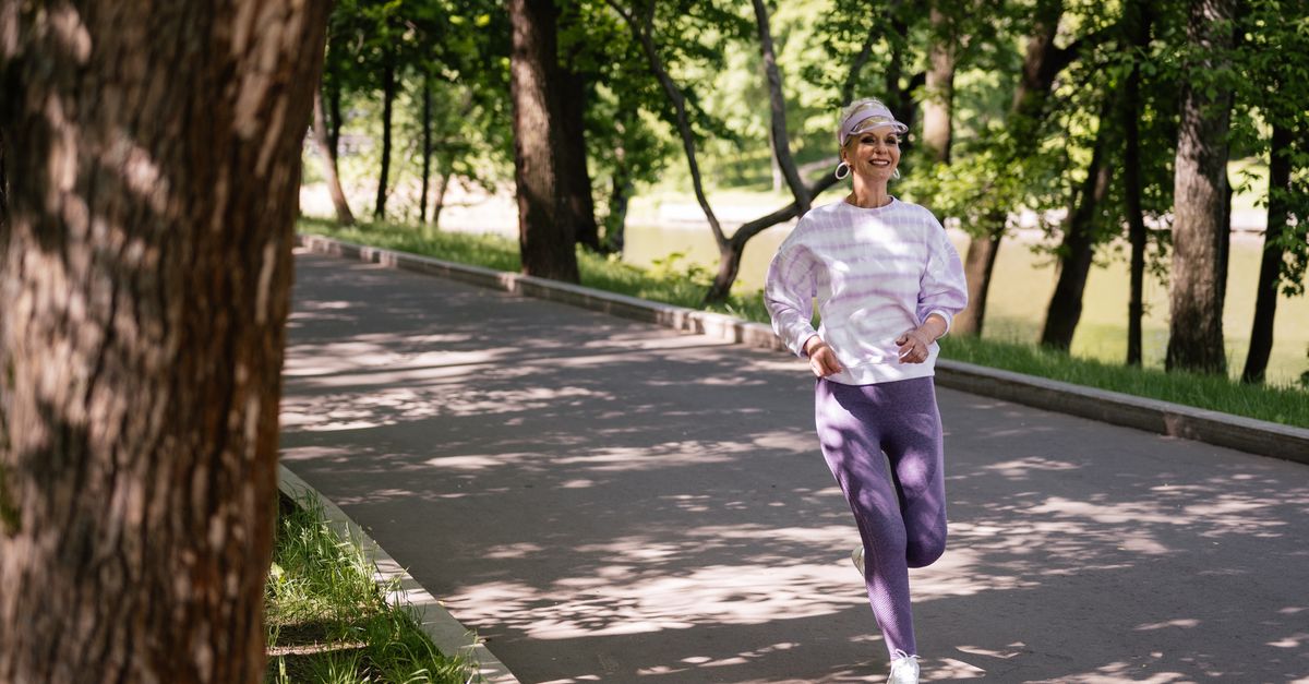 elderly woman running outdoors sunrise vitality
