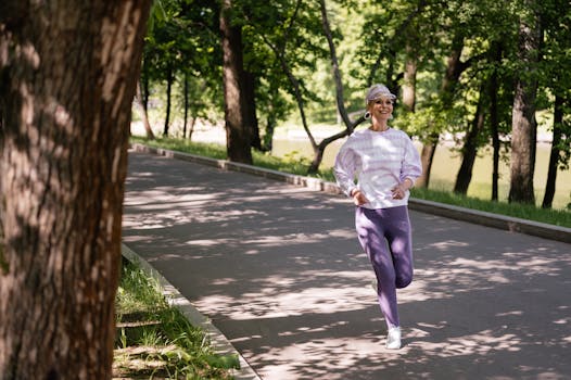 Elderly woman enjoying a refreshing jog in a lush green park during the day.