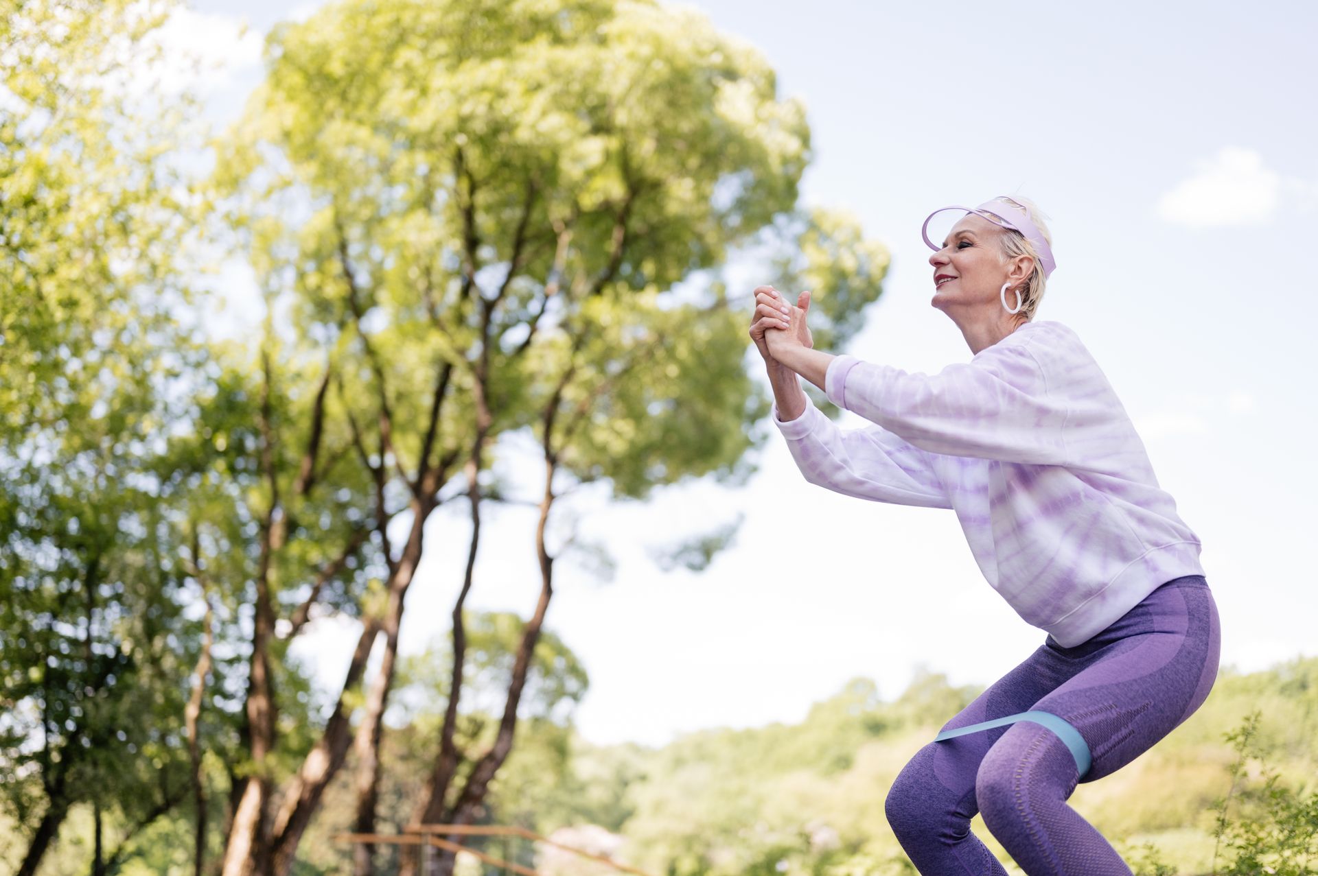 A Woman Working Out Using a Resistance Band