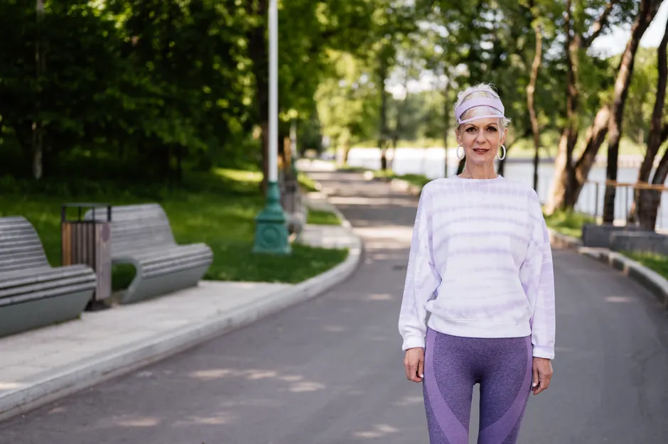 Healthy older woman exercising outdoors — longevity and healthspan science