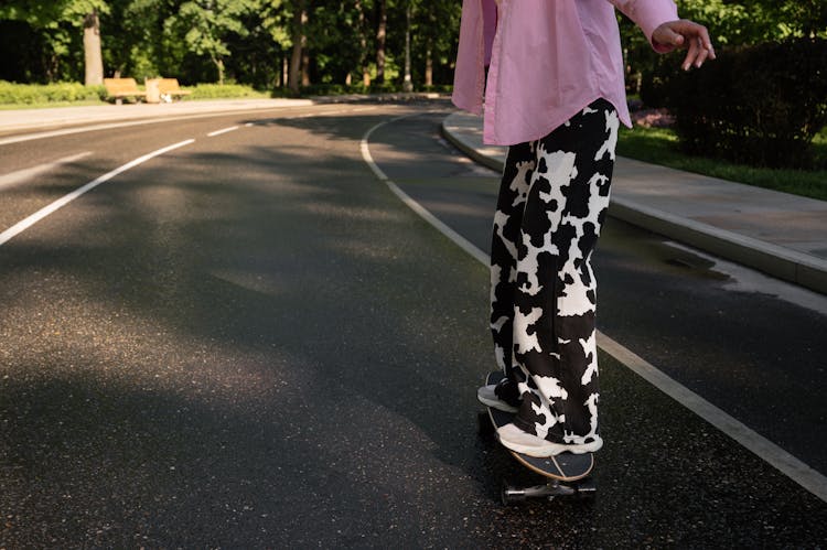 A Person In Animal Print Pants Skateboarding