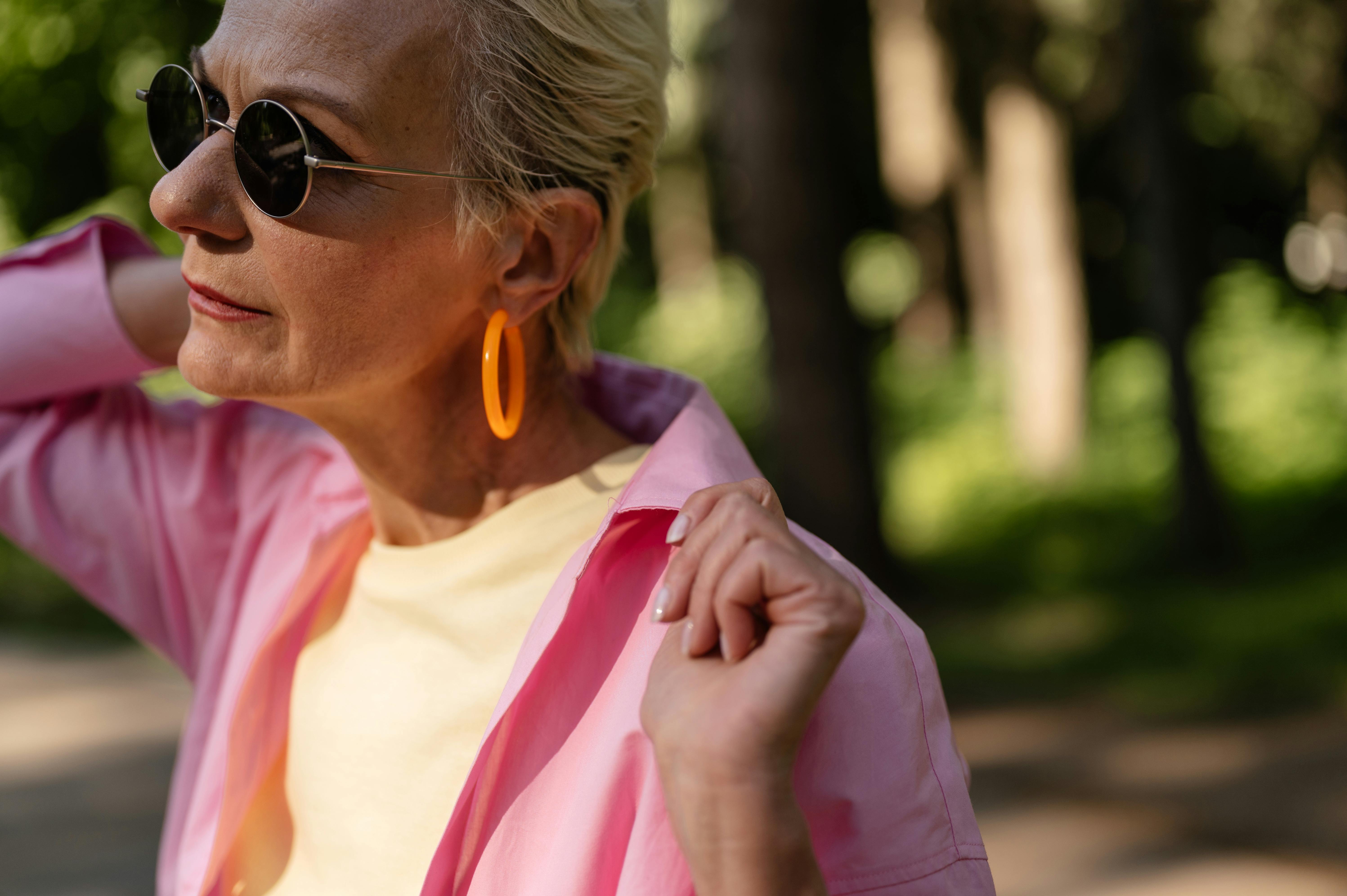 Woman Wearing Pendant Earrings and Sunglasses · Free Stock Photo