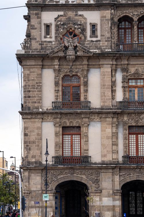 Free Close-up of a historic facade in Mexico City showcasing Gothic Revival architectural elements. Stock Photo