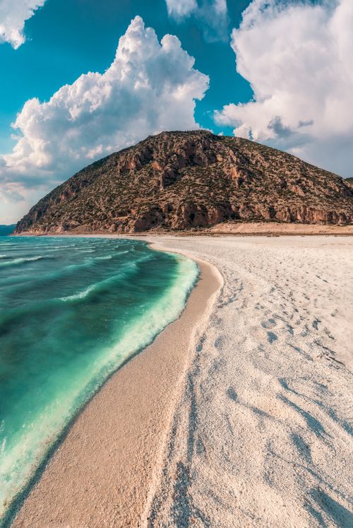 Free Stunning turquoise beach and scenic hills in Burdur, Türkiye, under a vibrant sky. Stock Photo