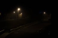 Empty Road Between Trees and Lighted Lamp · Free Stock Photo