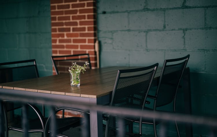 Steel And Wood Table With Chairs In Bar