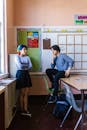 A Man and Woman Talking in the Classroom