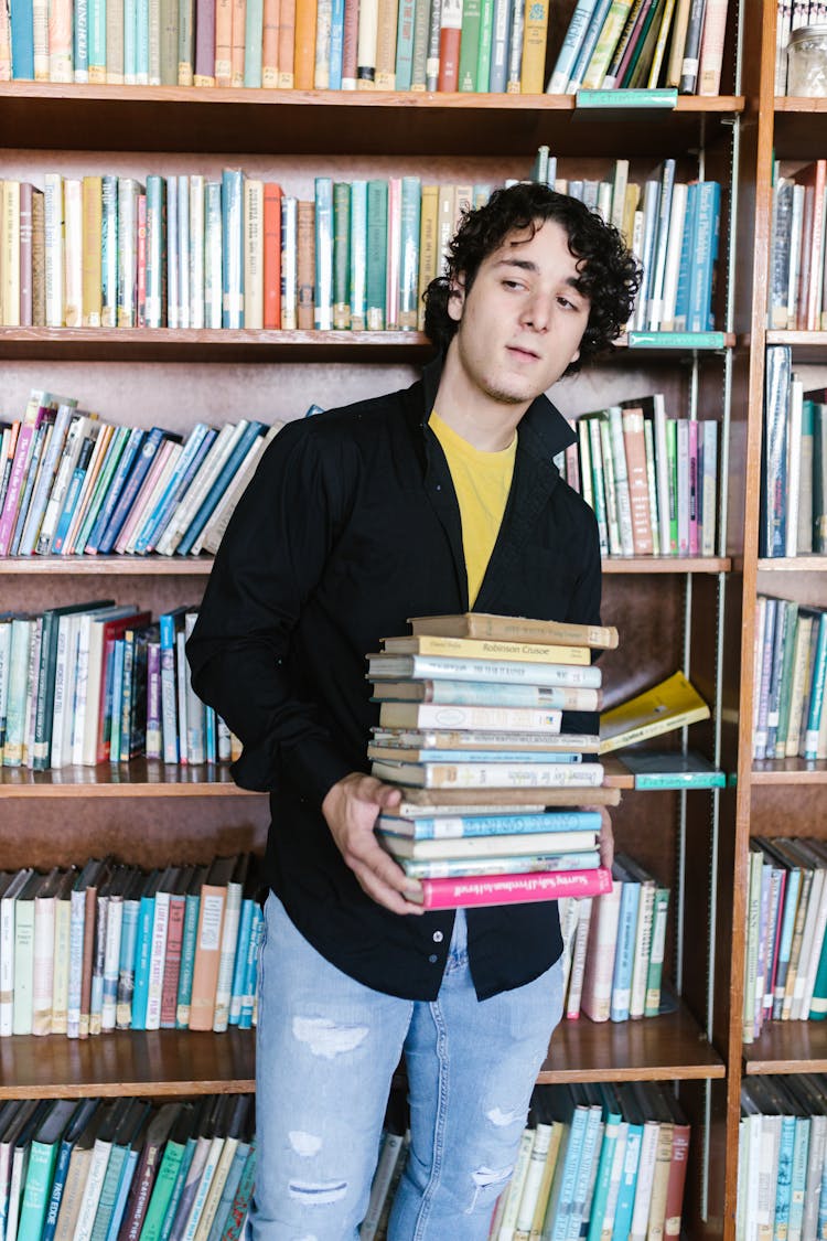 A Man Carrying Books