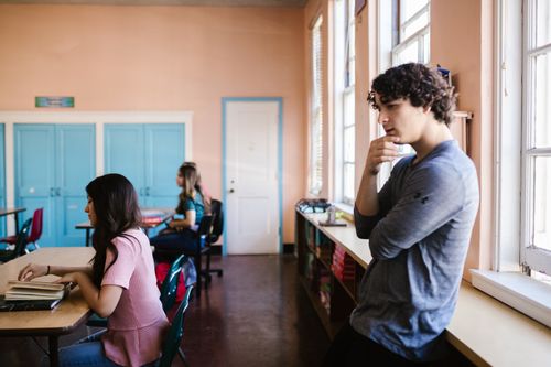 Free High school students studying and reflecting during classroom session. Stock Photo