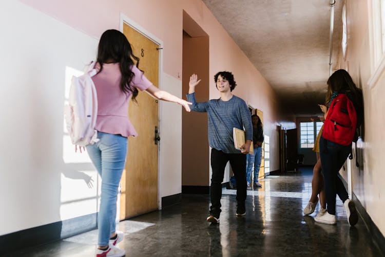 Students Standing On A Hallway