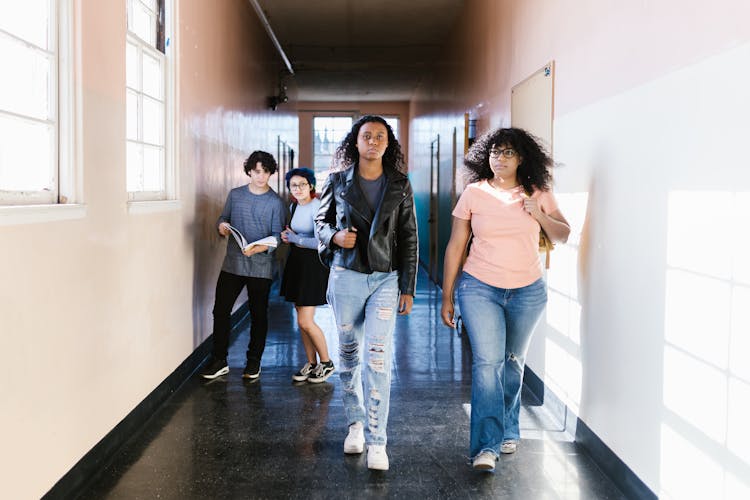 Students Walking On Hallway