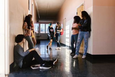 Students talking in a school corridor — photo by RDNE Stock project on Pexels