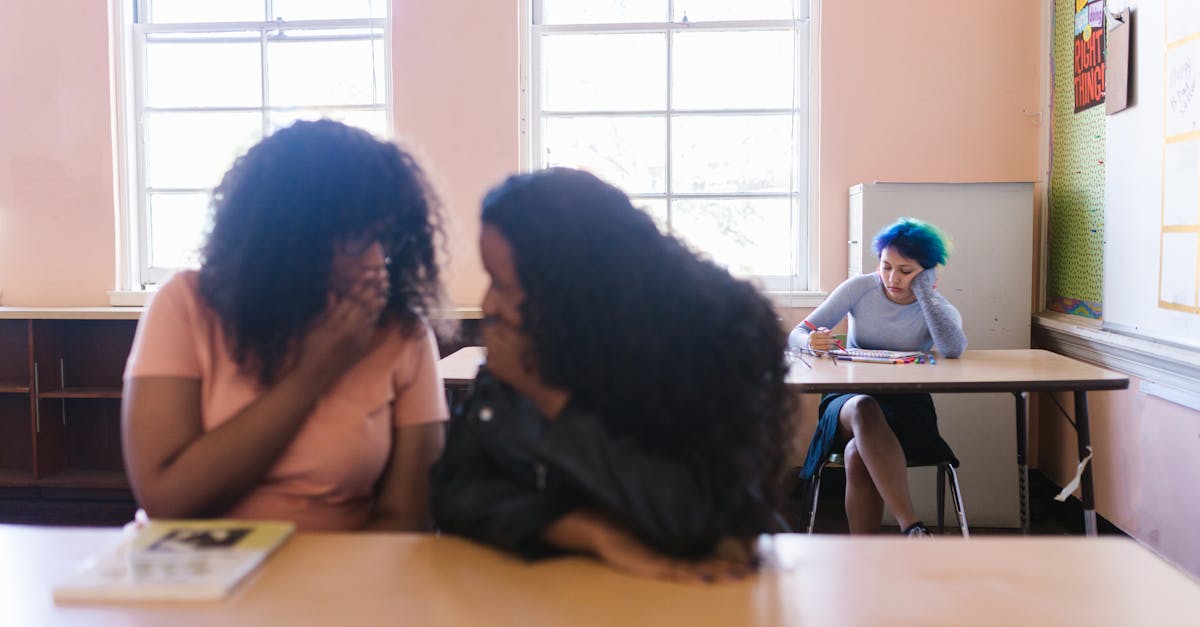 Group Of Women Gossiping In A Café Setting, With One Woman Looking Concerned While Others Whisper