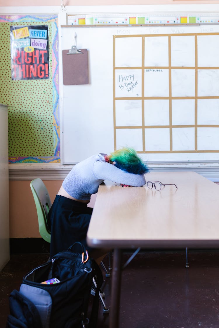 A Student Sitting On The Chair