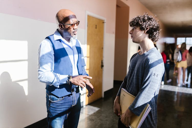 A Teacher Talking To His Student