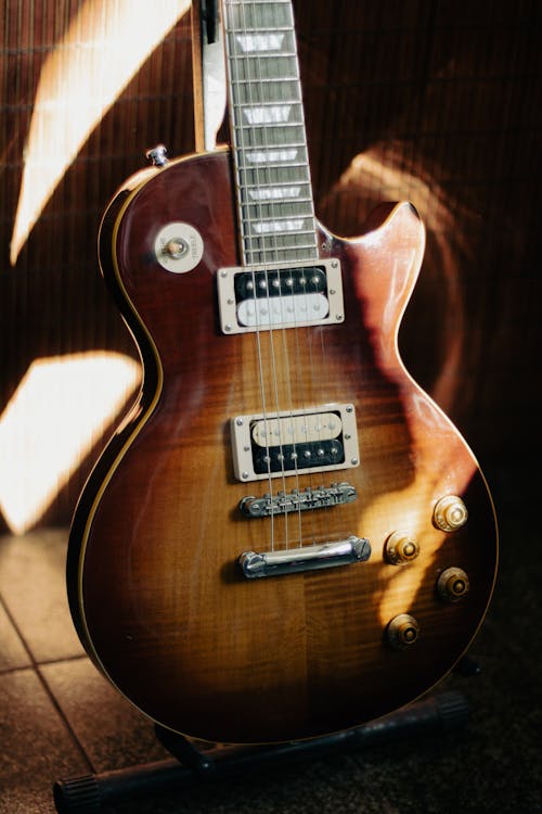 Close-Up Shot of a Brown Electric Guitar