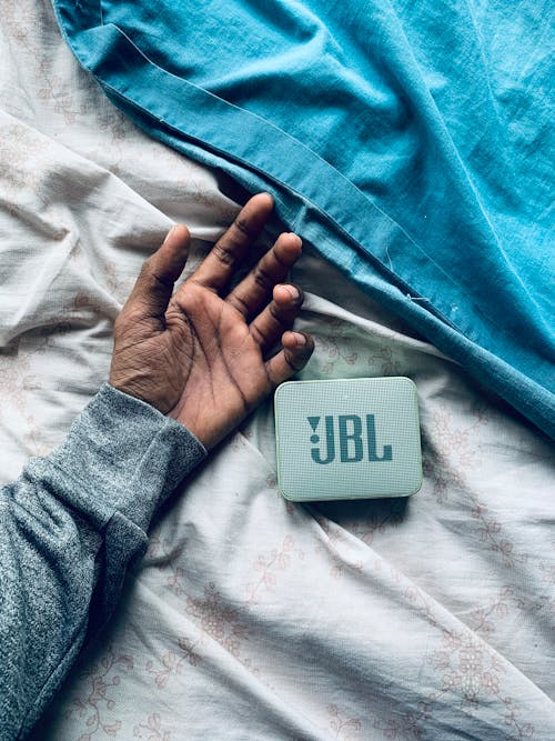 Free A Person's Hand and a JBL Speaker Stock Photo