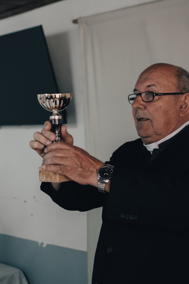 A Priest Celebrating The Holy Mass