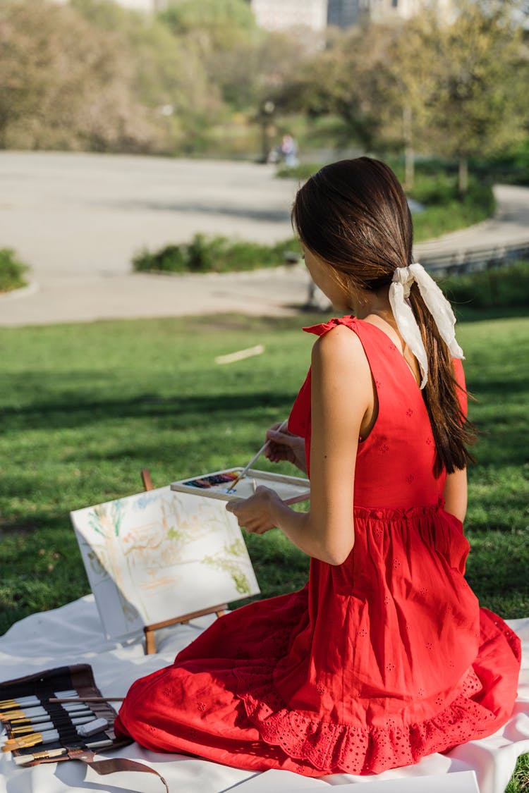 Woman Painting In Park