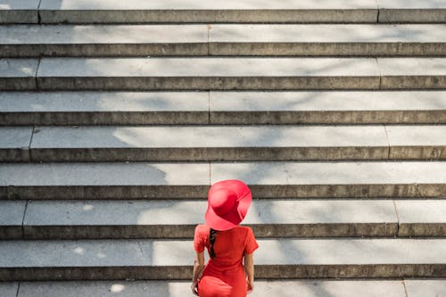 Woman in Red Dress Climbing the Stairs
