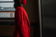 Side View of a Woman in Red Blazer