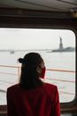 Woman in Red Blazer near the Window