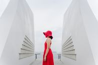Side View of a Woman in Red Sleeveless Dress