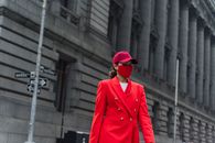 Close-Up Shot of a Woman in Red Blazer and Face Mask