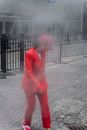 Man in Pink Suit Standing on Gray Concrete Floor
