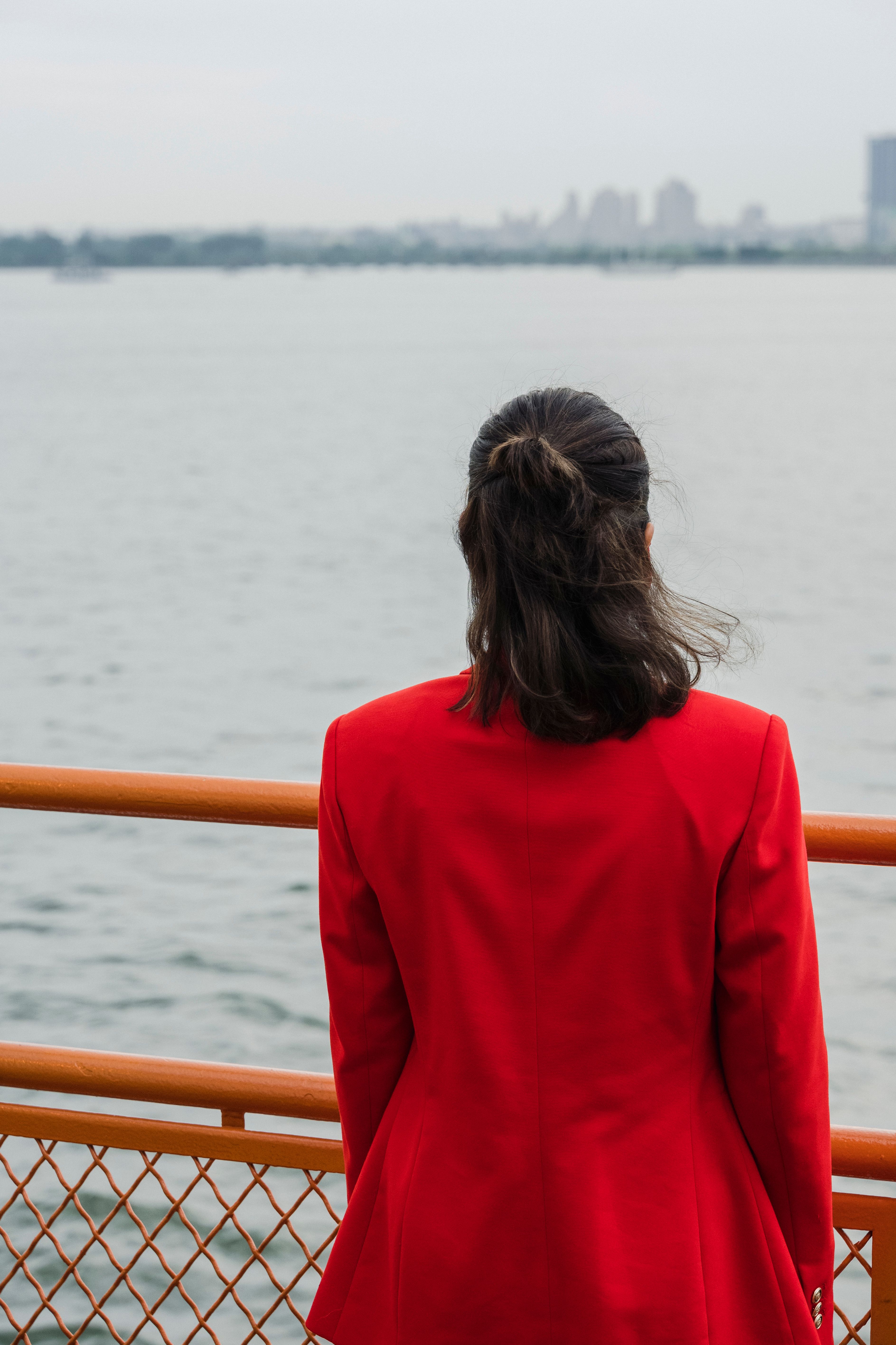 A Person Standing Near a Metal Railing · Free Stock Photo