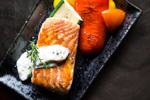 1993: Free Grilled Salmon Fish on Top of Grilled Vegetables Stock Photo