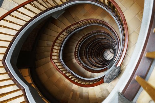 Free A mesmerizing spiral staircase in Hamburg, showcasing intricate design and geometric patterns from above. Stock Photo