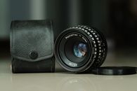 Black Camera Lens on Black Leather Case