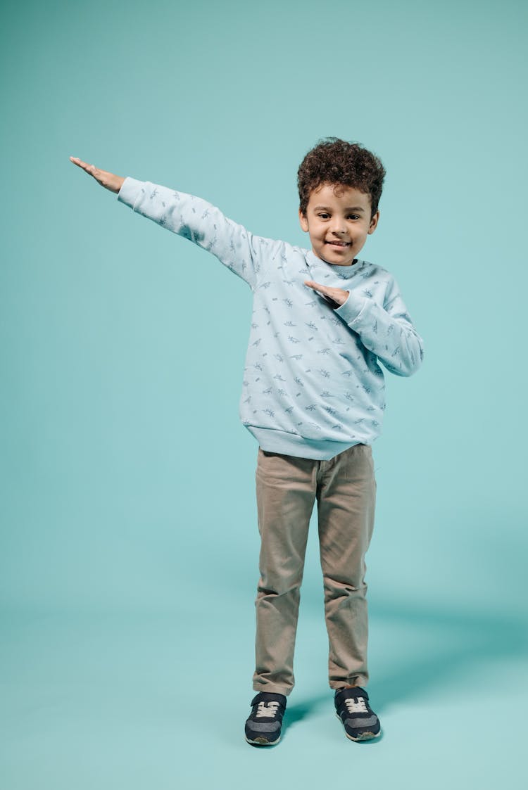 A Young Boy Wearing Sweater