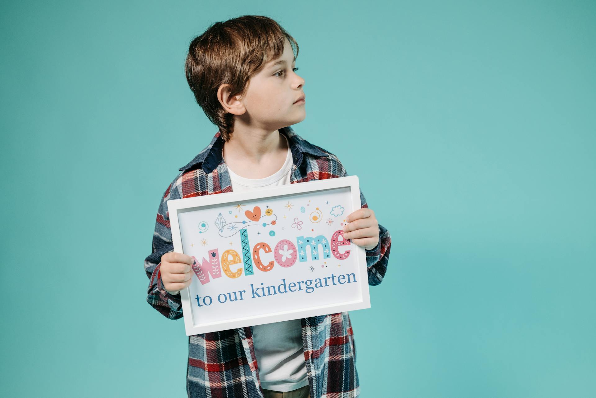 A Boy Holding a Poster