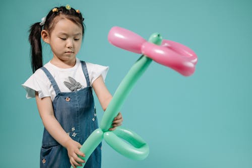 Girl Holding a Balloon