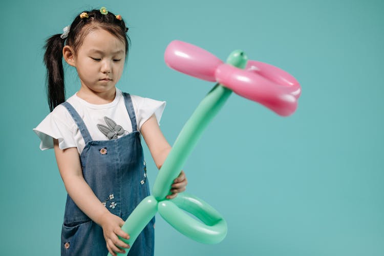 Girl Holding A Balloon